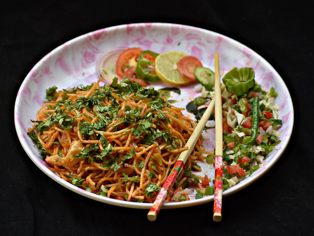 Vegetable hakka noodles with chopsticks